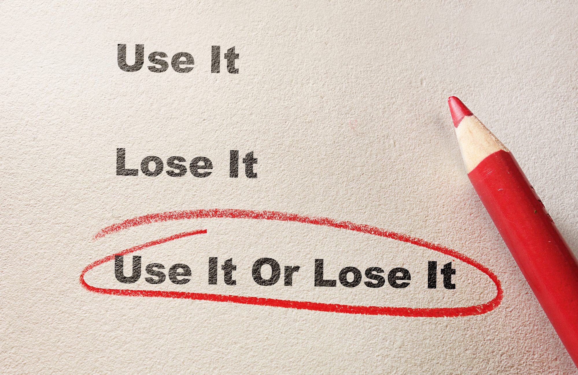 Red circle and pencil with Use It Or Lose It text -- exercise concept